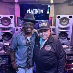 Jerry Wonda, left, and Superintendent León in the Platinum Sound studio control room.