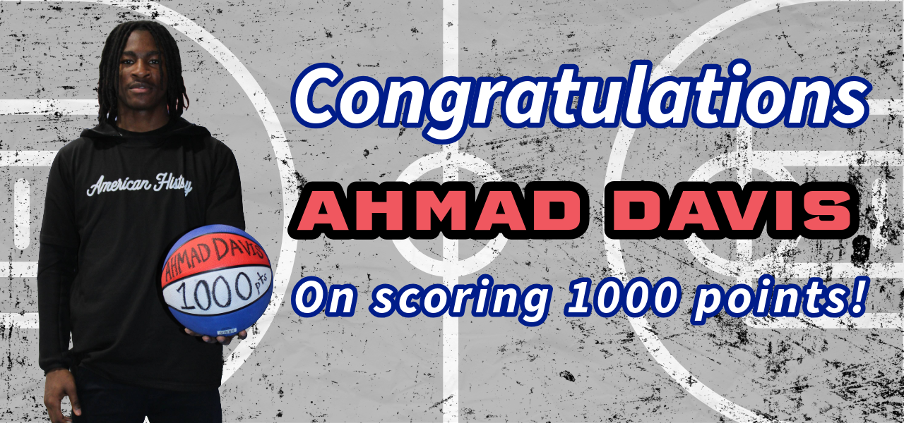 This slide says "Congratulations Ahmad David on scoring 1000 points" and has a picture of Davis wearing a black AHHS hoodie, holding a basketball that says his name and "1000 pts" on it.