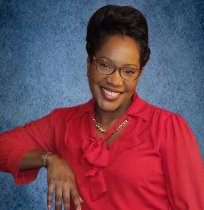 Angela Johnson, wearing a red, professional blouse