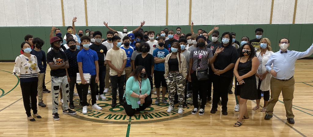 Image of students and staff in the gym.