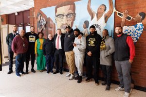 Rutgers Head Coach Greg Schiano pictured with MXS staff, Superintendent Roger León, coaches, and South Ward Councilman during his visit.