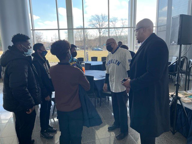 Mr. Muldrow III and Malcolm X Shabazz students engage Principal Kafele in a brief discussion about his keynote addres