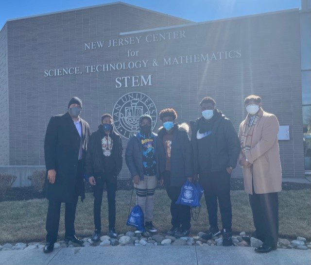 District Supervisor Vernon Pullins Jr., Mr. Muldrow III and Newark Board of Education students take a picture outside the New Jersey Center for Science, Technology and Mathematics (STEM) at Kean University where the symposium was held on Saturday, February 26, 2022