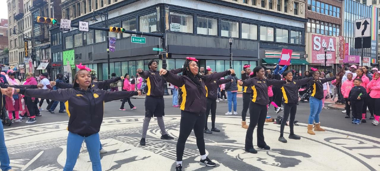 Members of the Malcolm X Shabazz Cheer Team perform at Broad and Market at the Annual Making Strides Against Breast Cancer Walk
