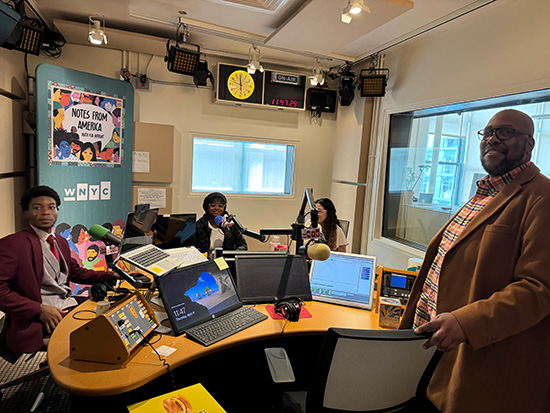 Students inside the WNYC Studios in New York being interviewed by Michael Hill