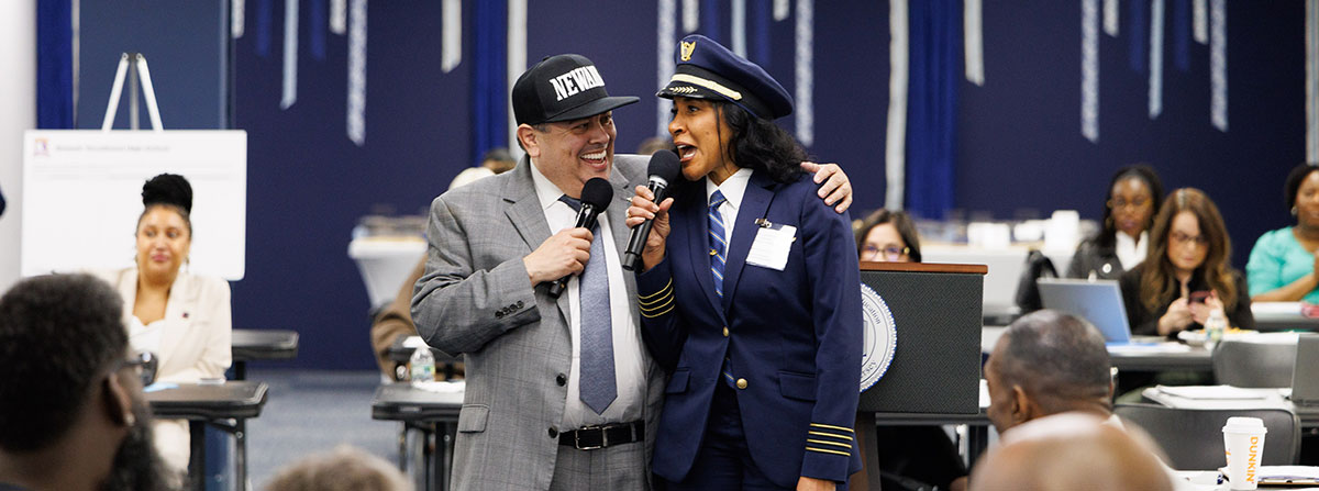 Superintendent Leon welcomes United Airlines Captain Carole Hopson to the Newark Public Schools Spring Convene meeting.