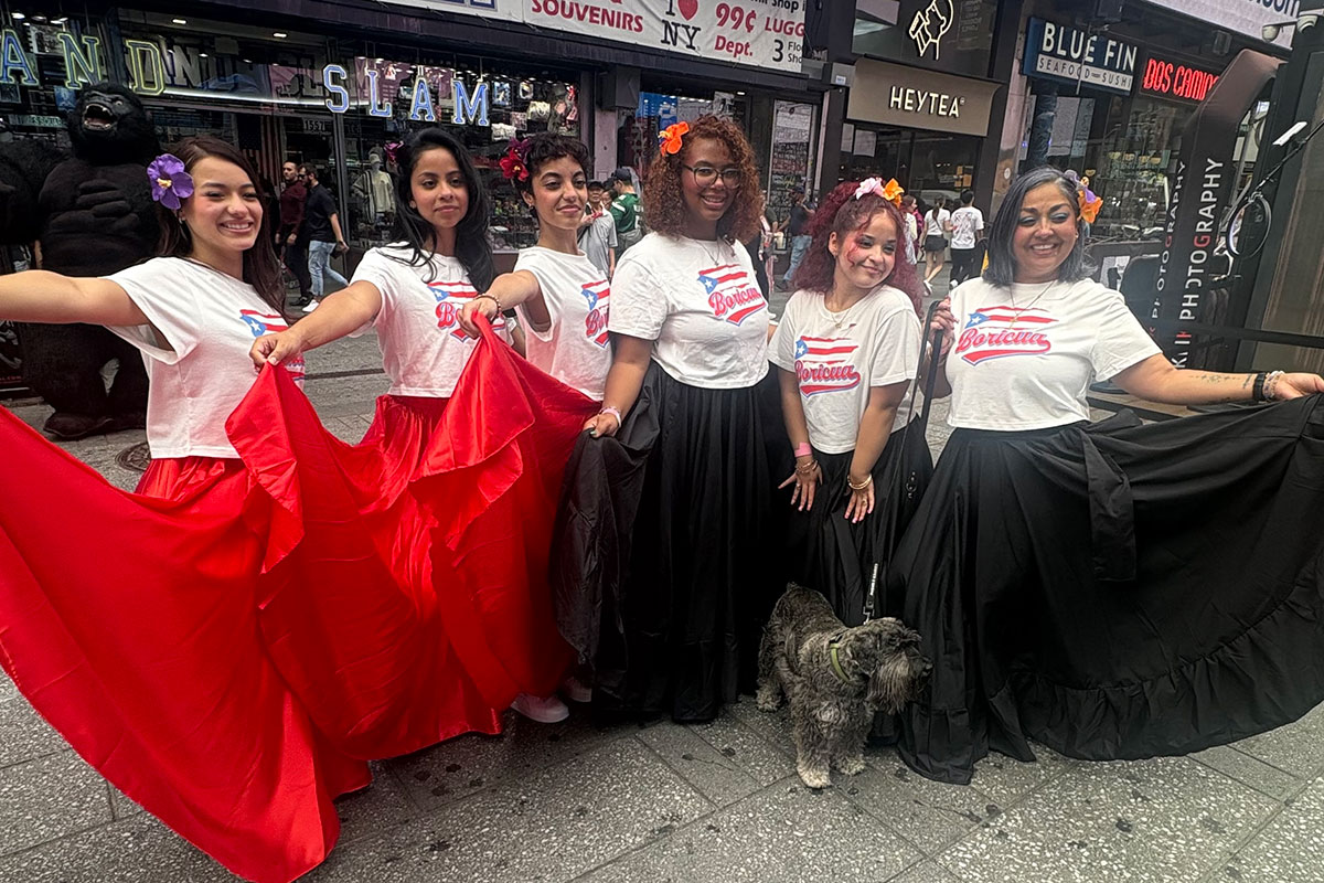 Betsy Bermudez Crespo, Arts High School Recreational Coordinator and Assistant Band Director, far right, and the rest of the Arts High School Latin Band Dancers.