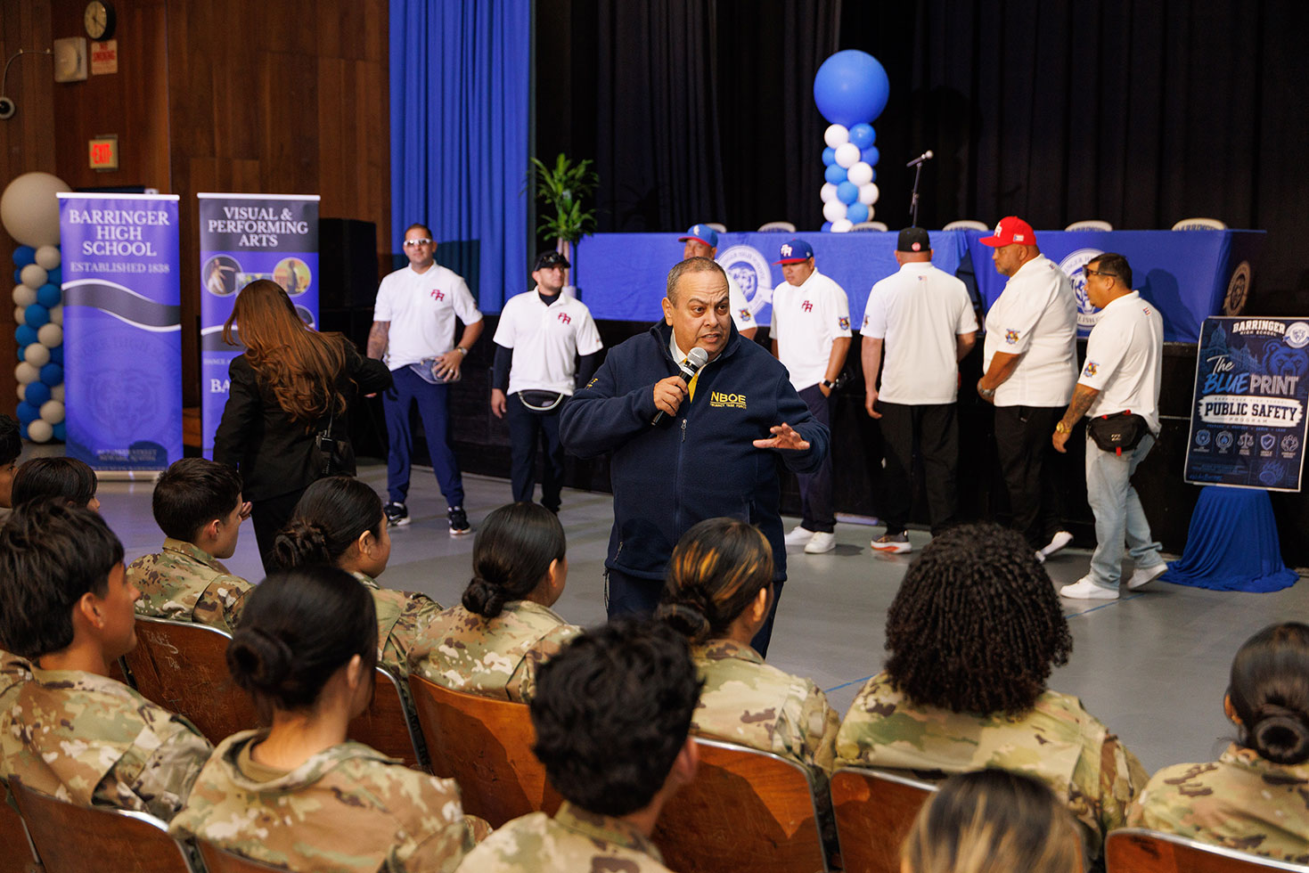 Superintendent León speaks with members of the Barringer High School Junior ROTC program.