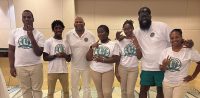 From left, Hassan Reed, Kazmir Cray, Young Entrepreneurz Solutions CEO Earnest Ruffin, Nia Jack, Brailynn George, West Side High School Principal Akbar Cook, and West Side High School Social Worker Jamila Hammond.